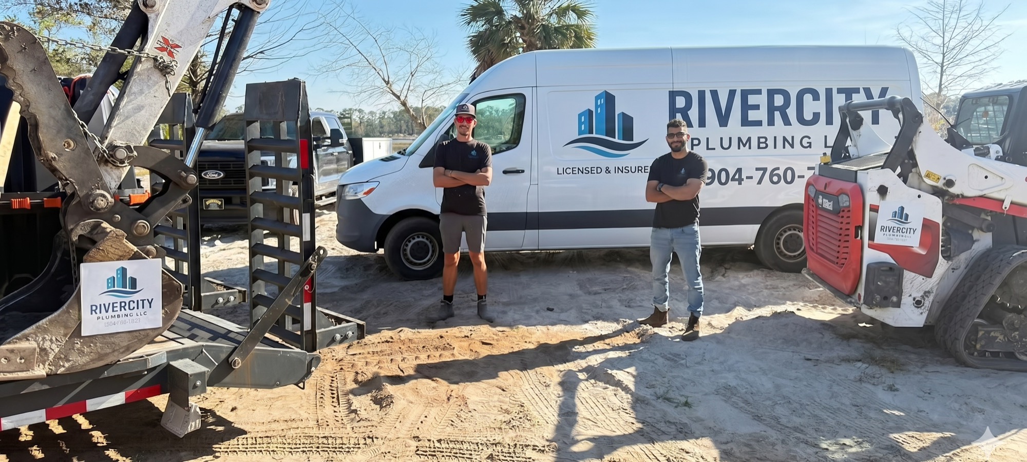 Nadav Farchi and Dustin Bradley, owners of RiverCity Plumbing, standing in front of their licensed and insured service van and equipment in Jacksonville, FL